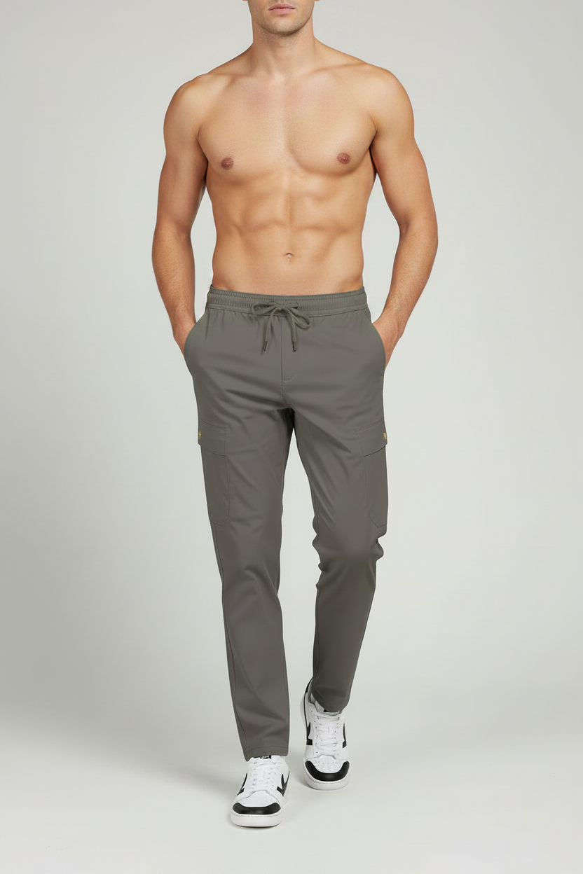 Man wearing gray pants on a plain background